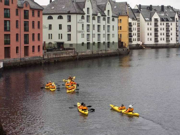 Seabourn guests kayak in Norway