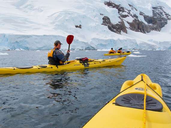 Guests kayaking in Neko Harbor, Antarctica, an area visited on an all-inclusive, luxury expedition Seabourn cruise.