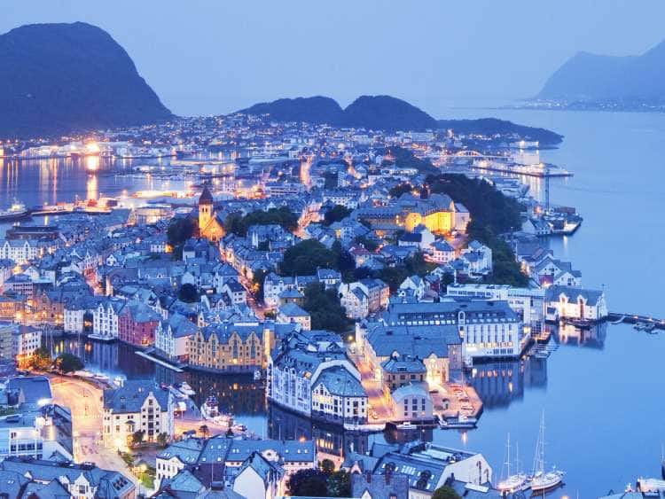 Norway, More og Romsdal, Alesund, Scandinavia, View from Aksla mountain towards old town and harbor illuminated at dusk