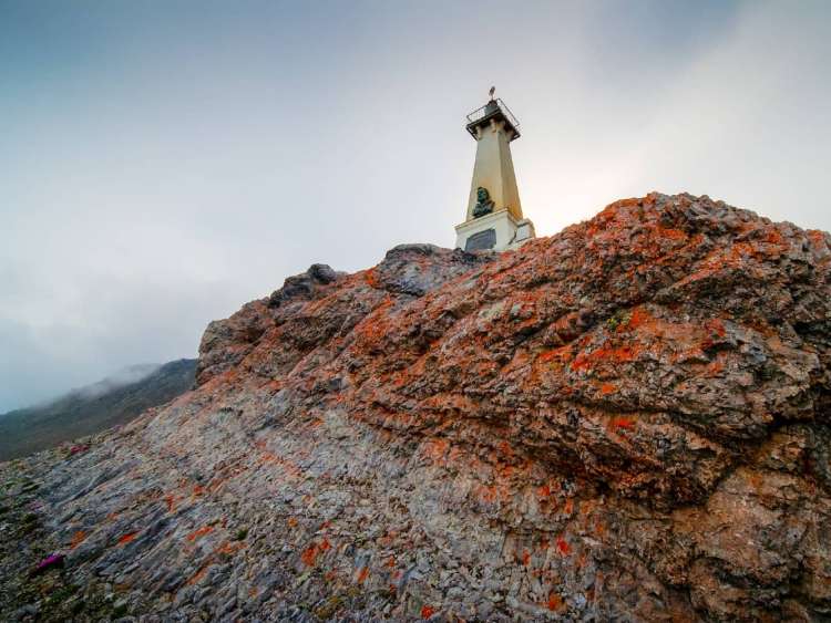 Lighthouse monument to Semen Dezhnev seen on Cape Dezhnev, Russia, a port visited on an all-inclusive, luxury Seabourn cruise.