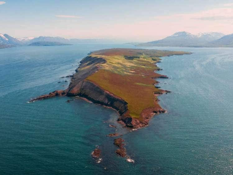 Aerial view of the Icelandic island, Hrisey, a port visited on an all-inclusive, luxury Seabourn cruise.