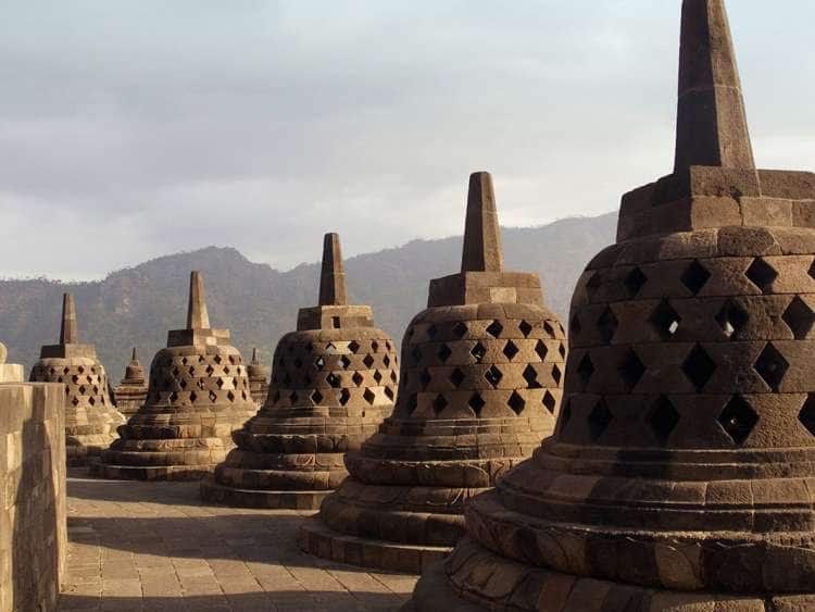 Indonesia, Java, Terrace with pierced stupas containing the statue of Buddha in the temple of Borobudur, 40 Km. at west of Yogyakarta.