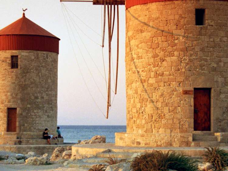 Greece, Aegean islands, Dodecanese, Greek Islands, Rhodes island, The characteristic byzantine windmills, Mandraki (port) part of Saint Nicholas Fort