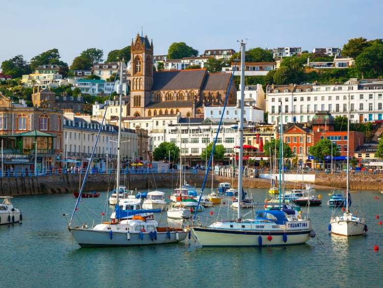 Ships in the harbor of Torquay, England, a port visited on an all-inclusive, luxury Seabourn cruise.