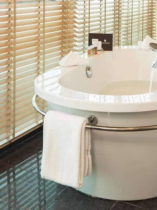 Bathtub in the Wintergarden Suite solarium aboard an all-inclusive, luxury Seabourn cruise.
