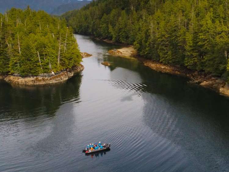 Aerial view of a group of Seabourn vacationers cruising up a river on one of many expeditions in Alaska