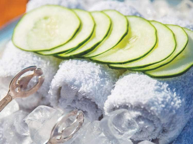 Chilled towels with cucumber slices over ice received on all all-inclusive cruises