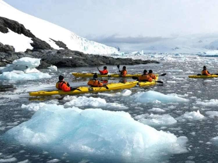 Guests enjoying a kayak excursion while on a Seabourn luxury cruise to South America and Antarctica