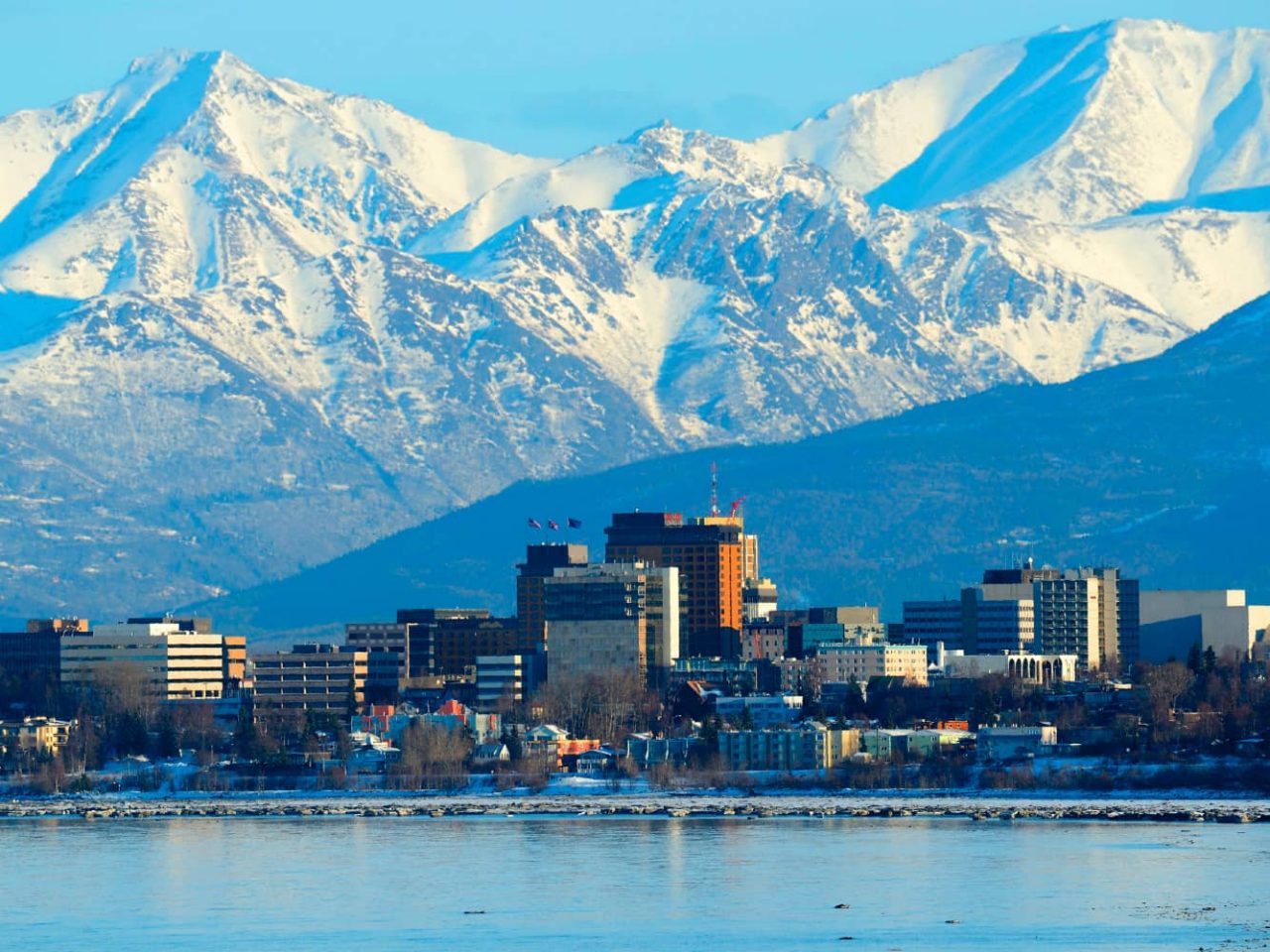City skyline of Anchorage, Alaska, a port along a cruise on an all-inclusive, luxury Seabourn ship.