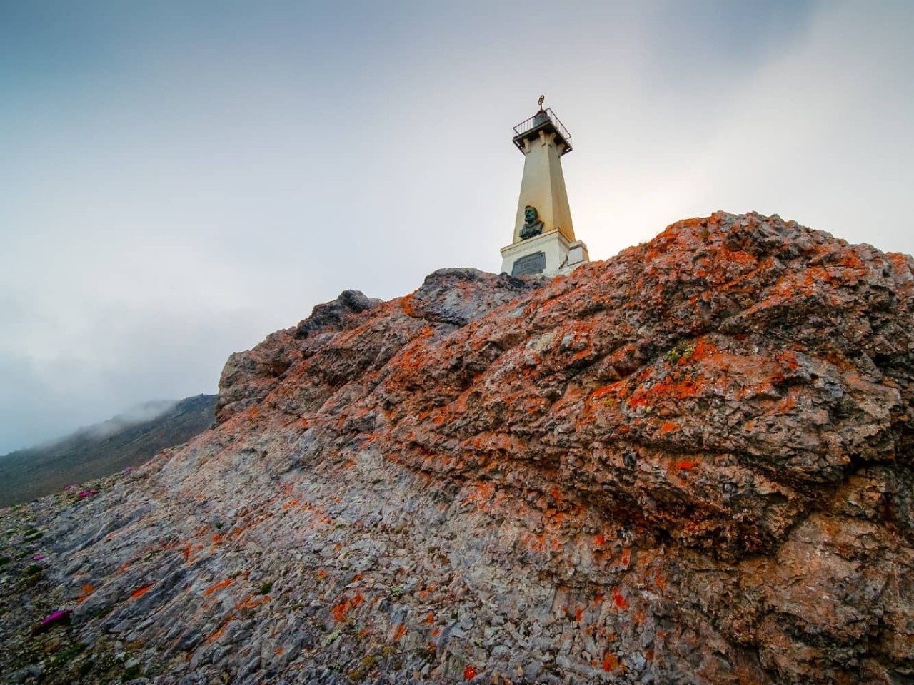 Lighthouse monument to Semen Dezhnev seen on Cape Dezhnev, Russia, a port visited on an all-inclusive, luxury Seabourn cruise. 