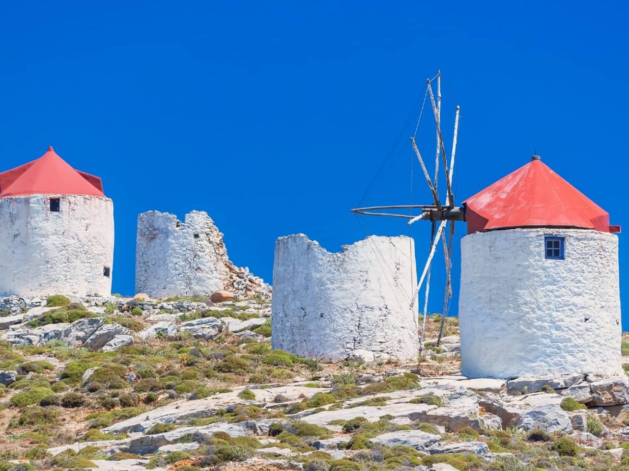 Traditional windmills on Amorgos Island, Greece, a port visited on an all-inclusive, luxury Seabourn cruise. 