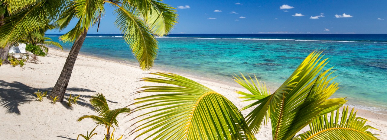 Cook Islands, Rarotonga, South Seas, Palm-lined Beach at the Crown Beach Resort near Arorangi