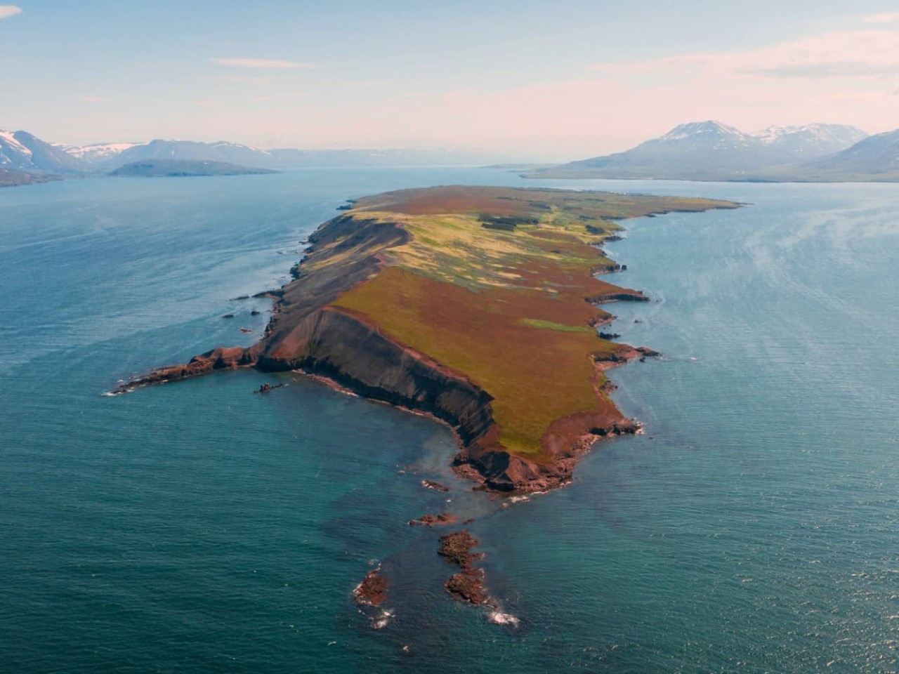 Aerial view of the Icelandic island, Hrisey, a port visited on an all-inclusive, luxury Seabourn cruise. 