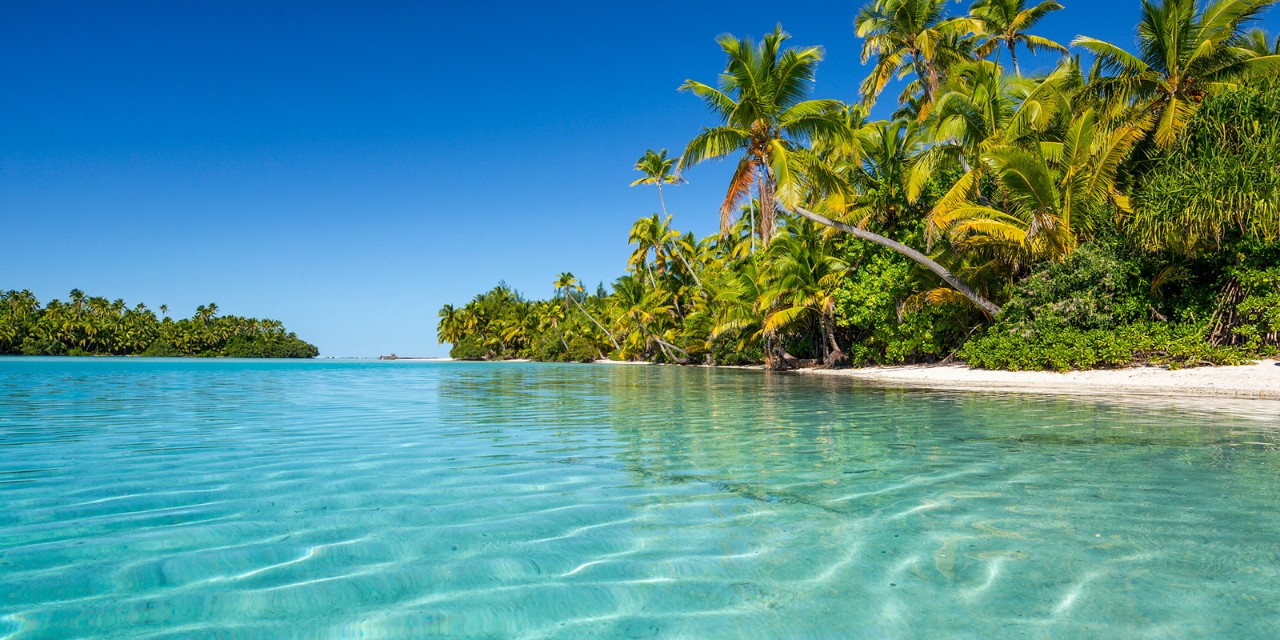 Cook Islands, Aitutaki, South Seas, Palm-lined Beach on Motu One Foot Island in the Lagoon of Aitutaki Island