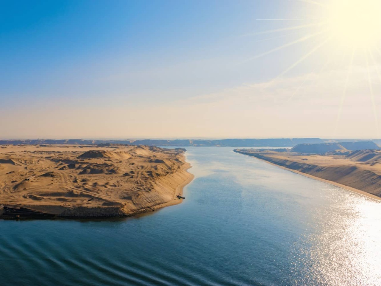 Sandy terrain flanks the Suez Canal, a port visited on an all-inclusive, luxury Seabourn cruise. 