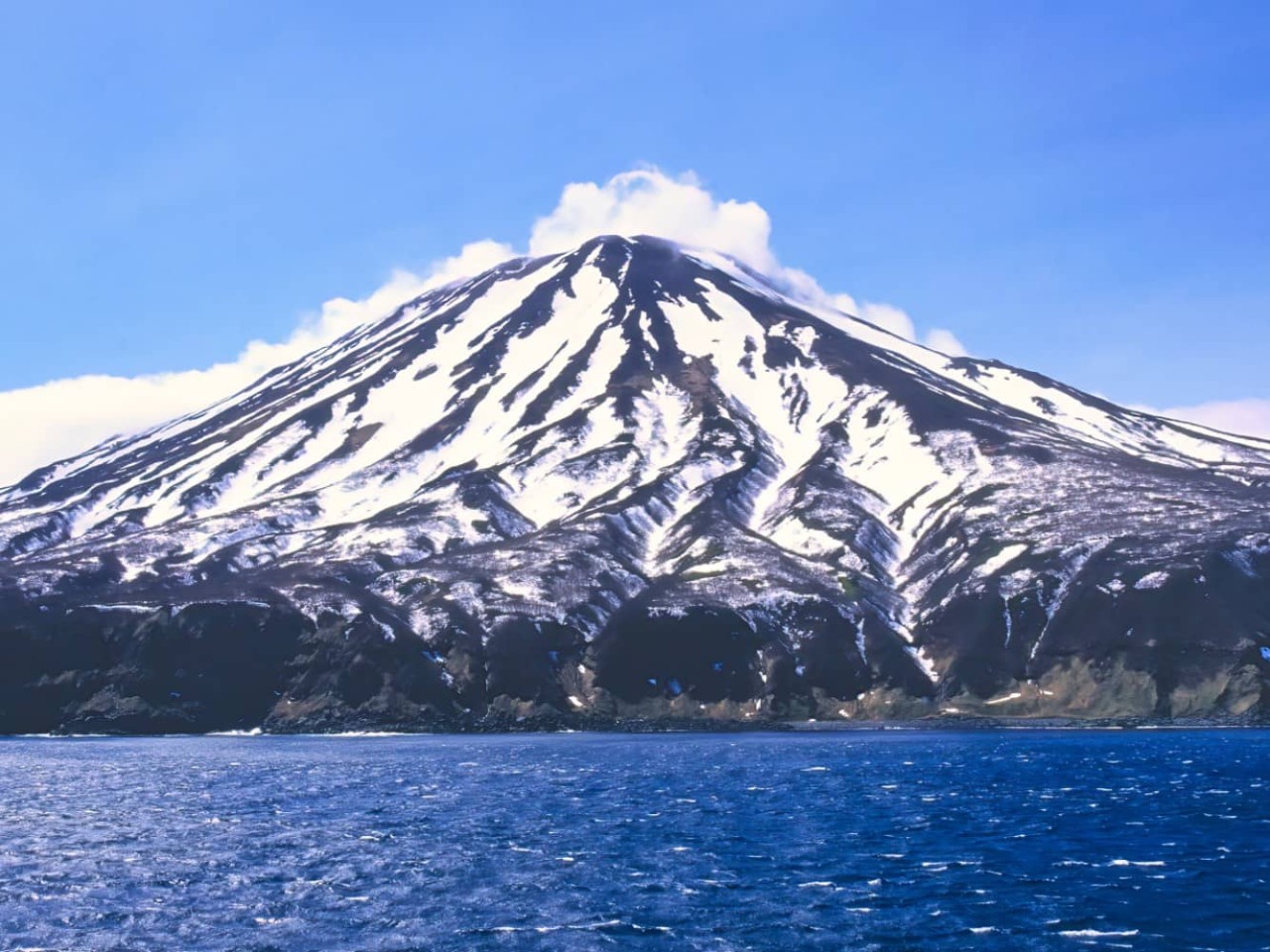 View of a stratovolcano on Simushir Island, Russia, a port visited on an all-inclusive, luxury expedition Seabourn cruise. 