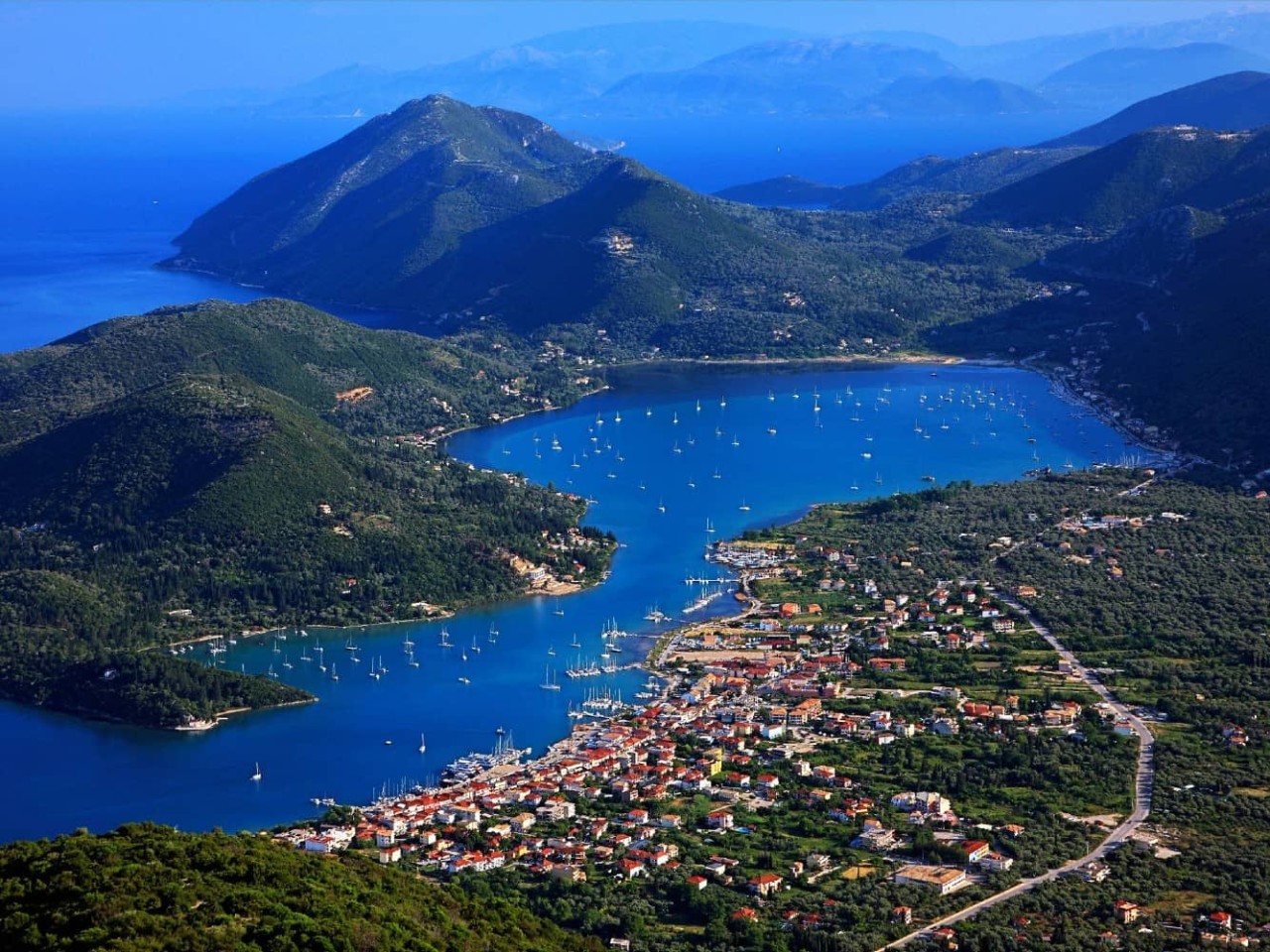 Aerial view of the harbor at Nydri, Greece, a port visited on an all-inclusive, luxury Seabourn cruise. 