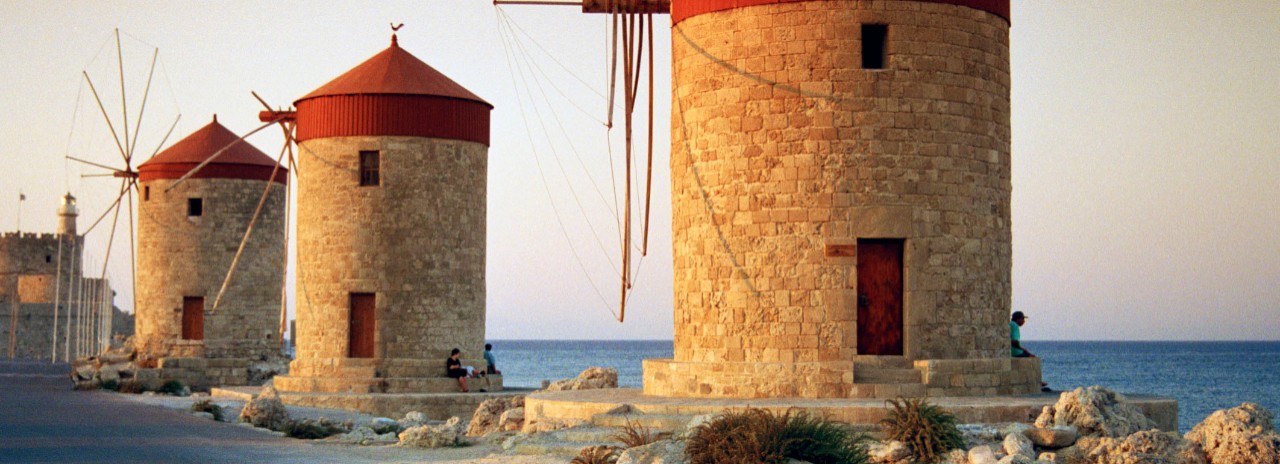 Greece, Aegean islands, Dodecanese, Greek Islands, Rhodes island, The characteristic byzantine windmills, Mandraki (port) part of Saint Nicholas Fort