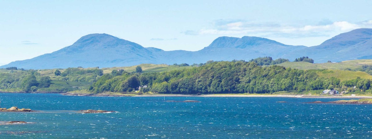 Scottish waters with mountain silhouette in back