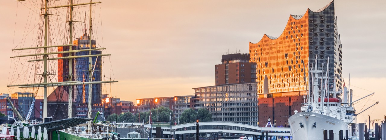 Cap San Diego Museum Ship at Uberseebrucke (Overseas Bridge) with Elbe Philharmonic Hall (Elbphilharmonie) in HafenCity District (Harbor City), Hamburg, Germany