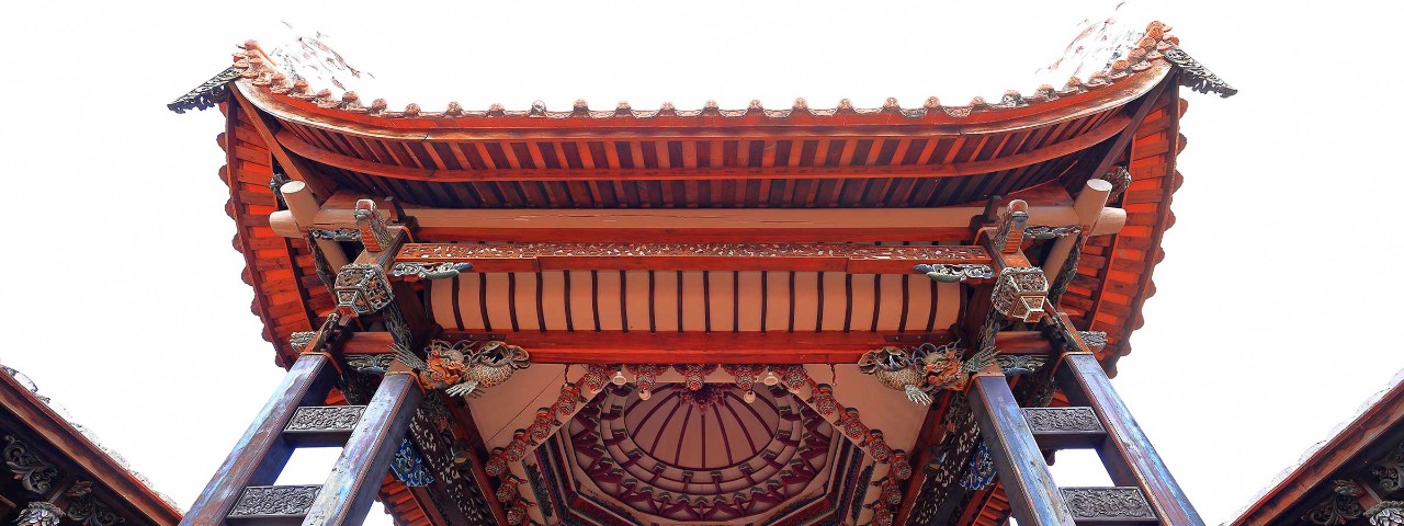 Ornate temple in Taichung Taiwan with red roof and dragon decorations