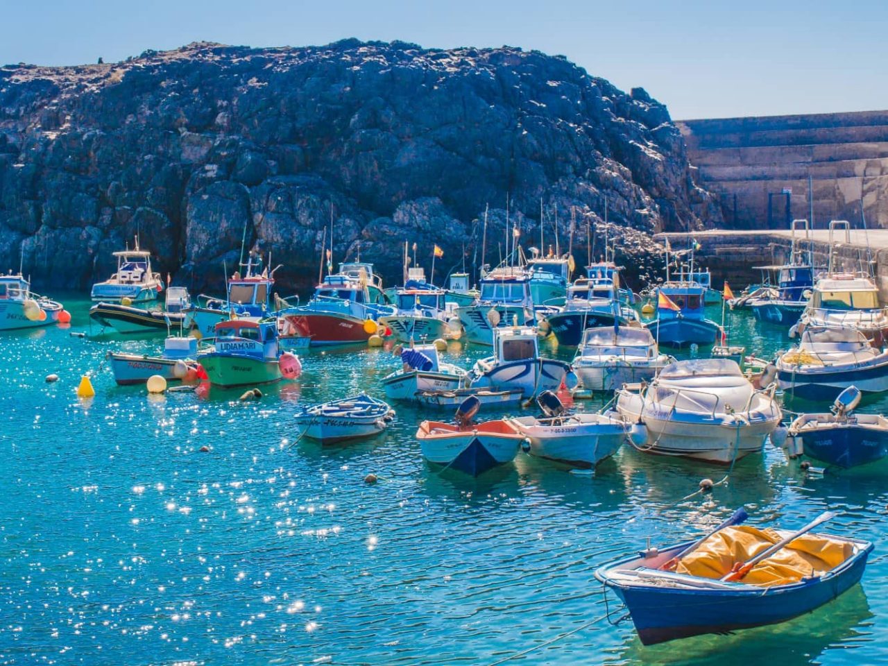 View of boats in a harbor in Fuerteventura, Canary Islands, Spain, a port visited on an all-inclusive, luxury Seabourn cruise. 