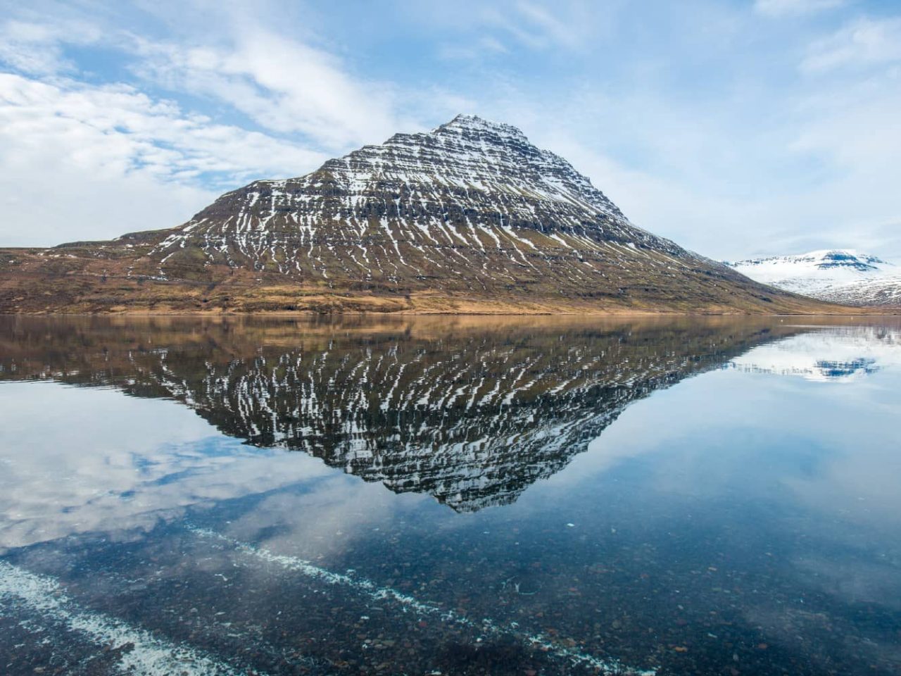 Holmatindur mountain seen in Eskifjordur, Iceland, a port visited on a luxury, all-inclusive, Seabourn cruise. 