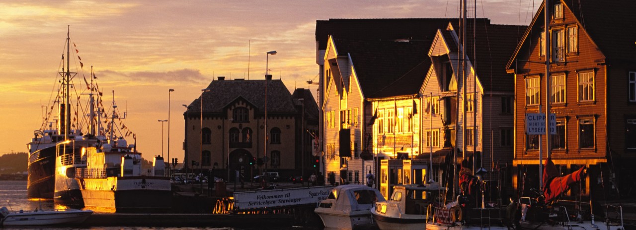 Norway, Rogaland, Stavanger, Vaagen harbour, On the right old wooden houses and old storehouses along Skansegata street