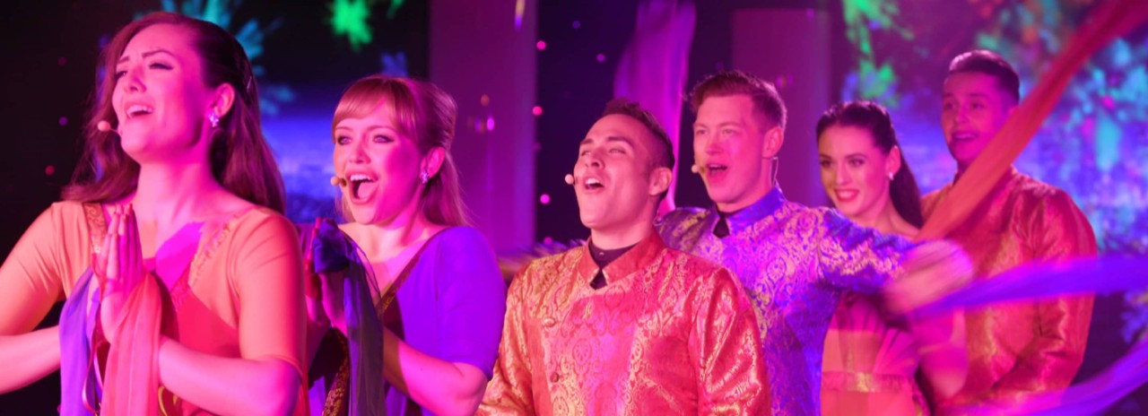 Vocal performance group sings in the Grand Salon on an all-inclusive, luxury Seabourn cruise. 